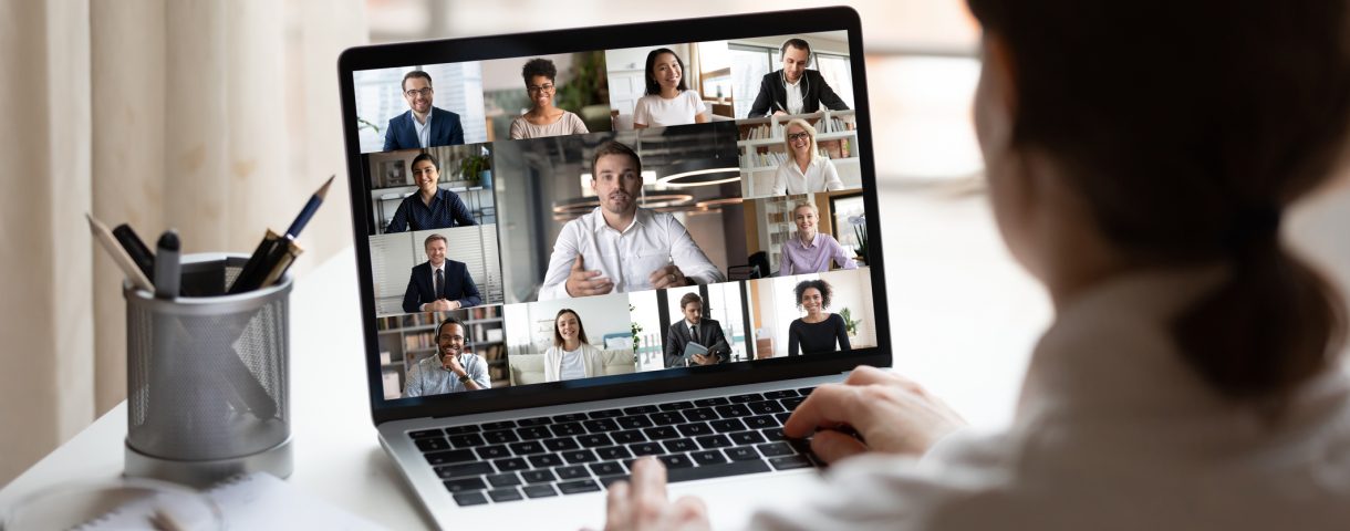 On laptop diverse people collage webcam view over woman shoulder